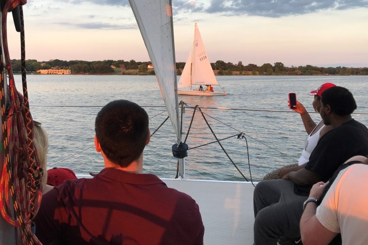 a couple of people on a boat in a body of water