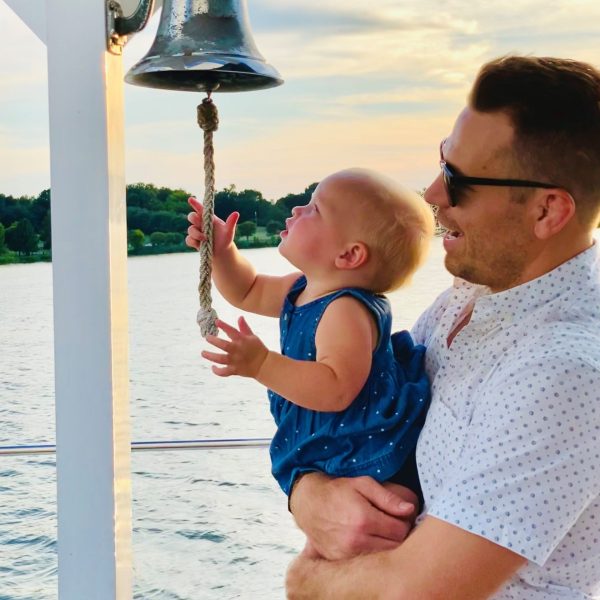 a man standing in front of water